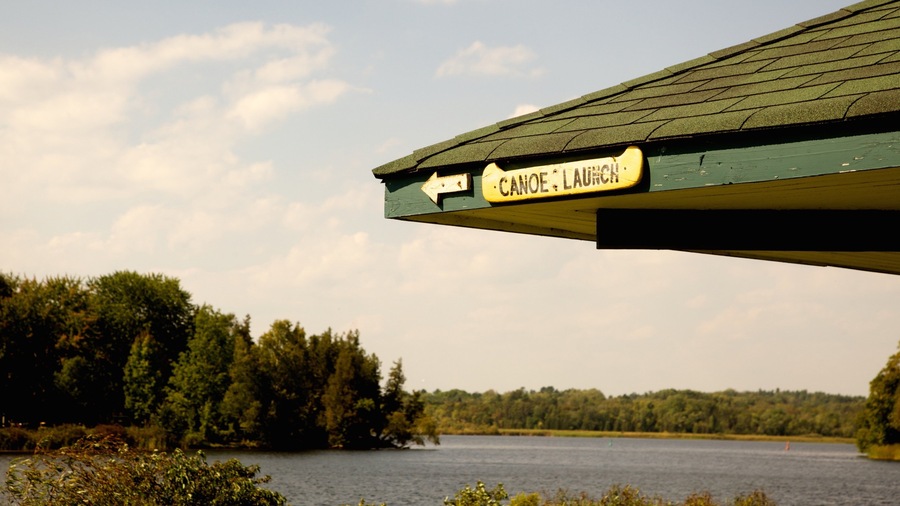 Peterborough featuring forests, a lake or waterhole and signage