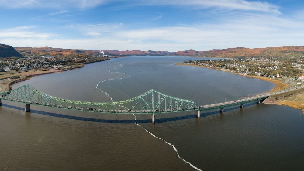 Aerial panoramic view of J.C. Van Horne Bridge that runs from Pointe-à-la-Croix, Quebec, to Campbellton, New Brunswick, Canada.