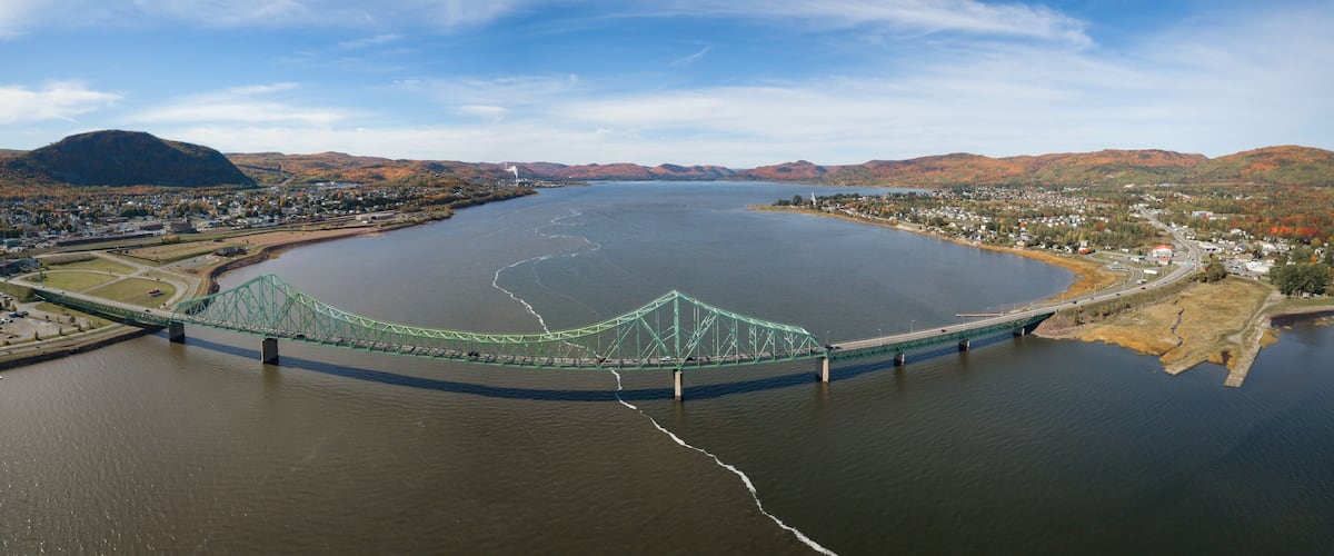 Aerial panoramic view of J.C. Van Horne Bridge that runs from Pointe-à-la-Croix, Quebec, to Campbellton, New Brunswick, Canada.