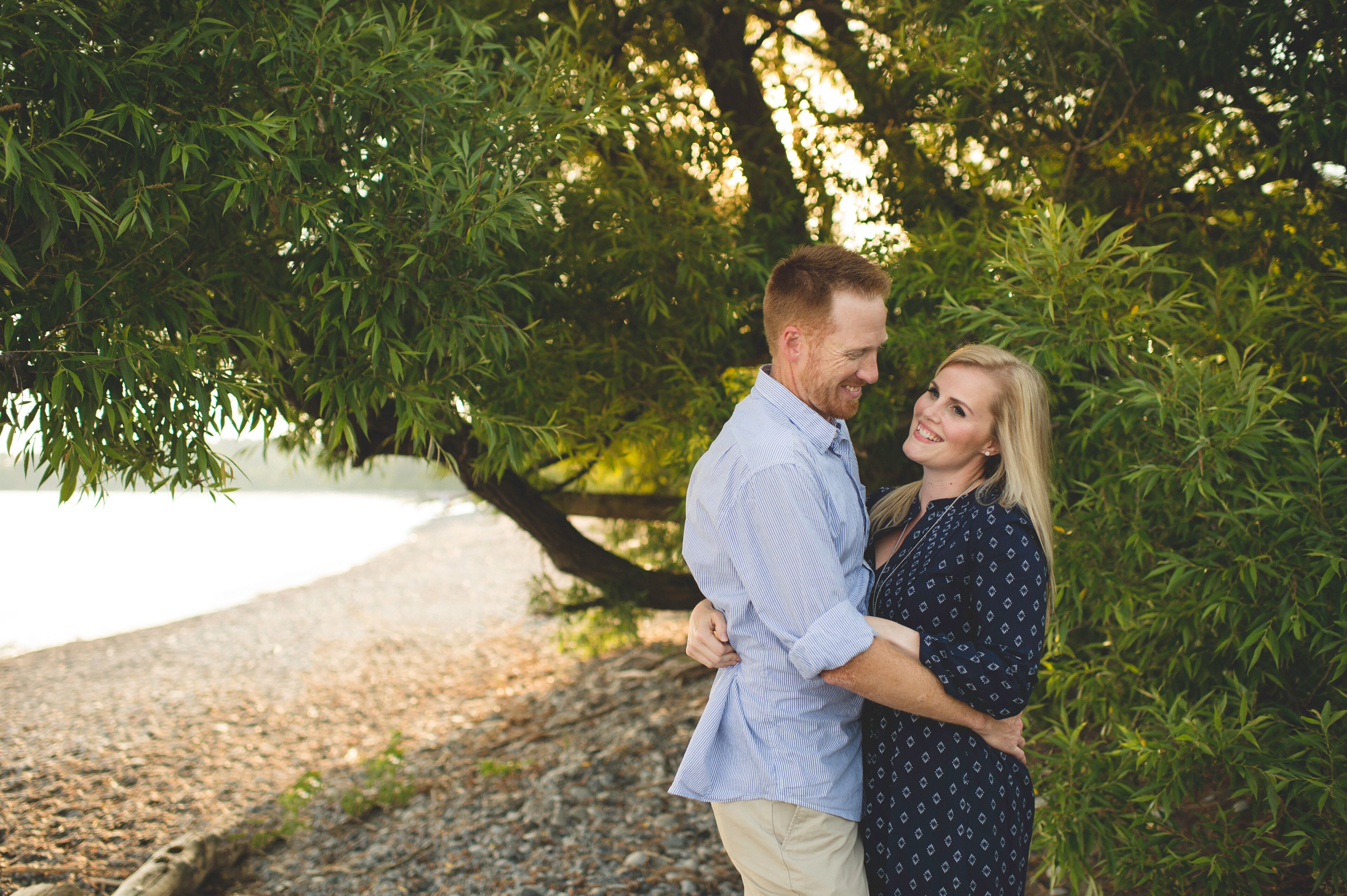 Mid adult couple hugging at Lake Ontario, Oshawa, Canada