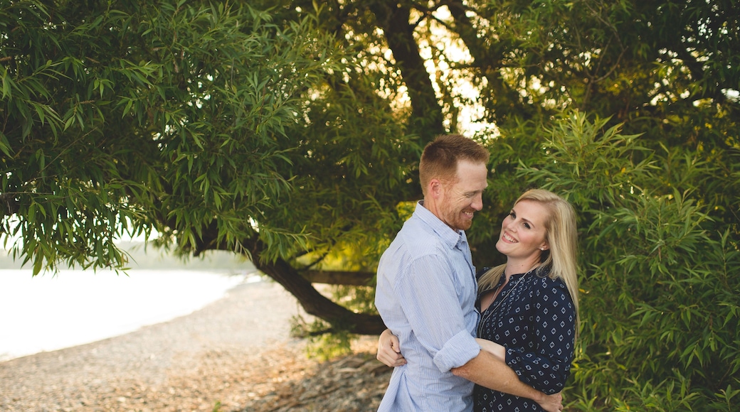 Mid adult couple hugging at Lake Ontario, Oshawa, Canada