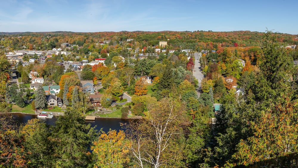 Huntsville aerial view with the city houses and the Muskoka River between Hunters Bay and Fairy Lake