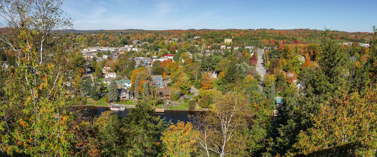 Huntsville aerial view with the city houses and the Muskoka River between Hunters Bay and Fairy Lake