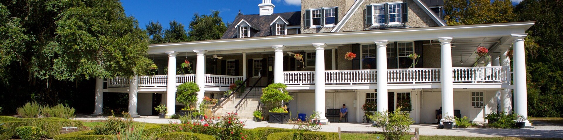 Magnolia Plantation and Gardens mostrando elementos patrimoniales, una casa y un parque