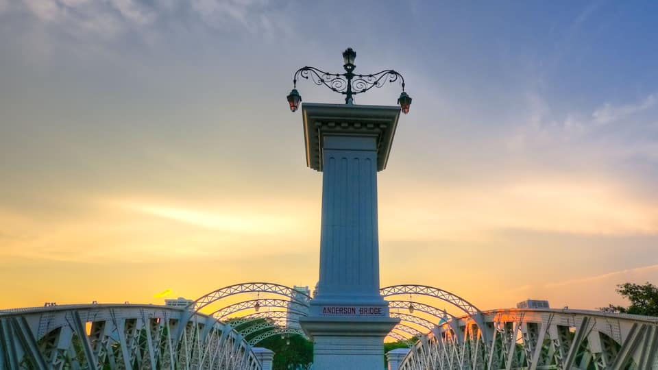 A bridge with a central monument labeled 'Anderson Bridge' and a sunset in the background.