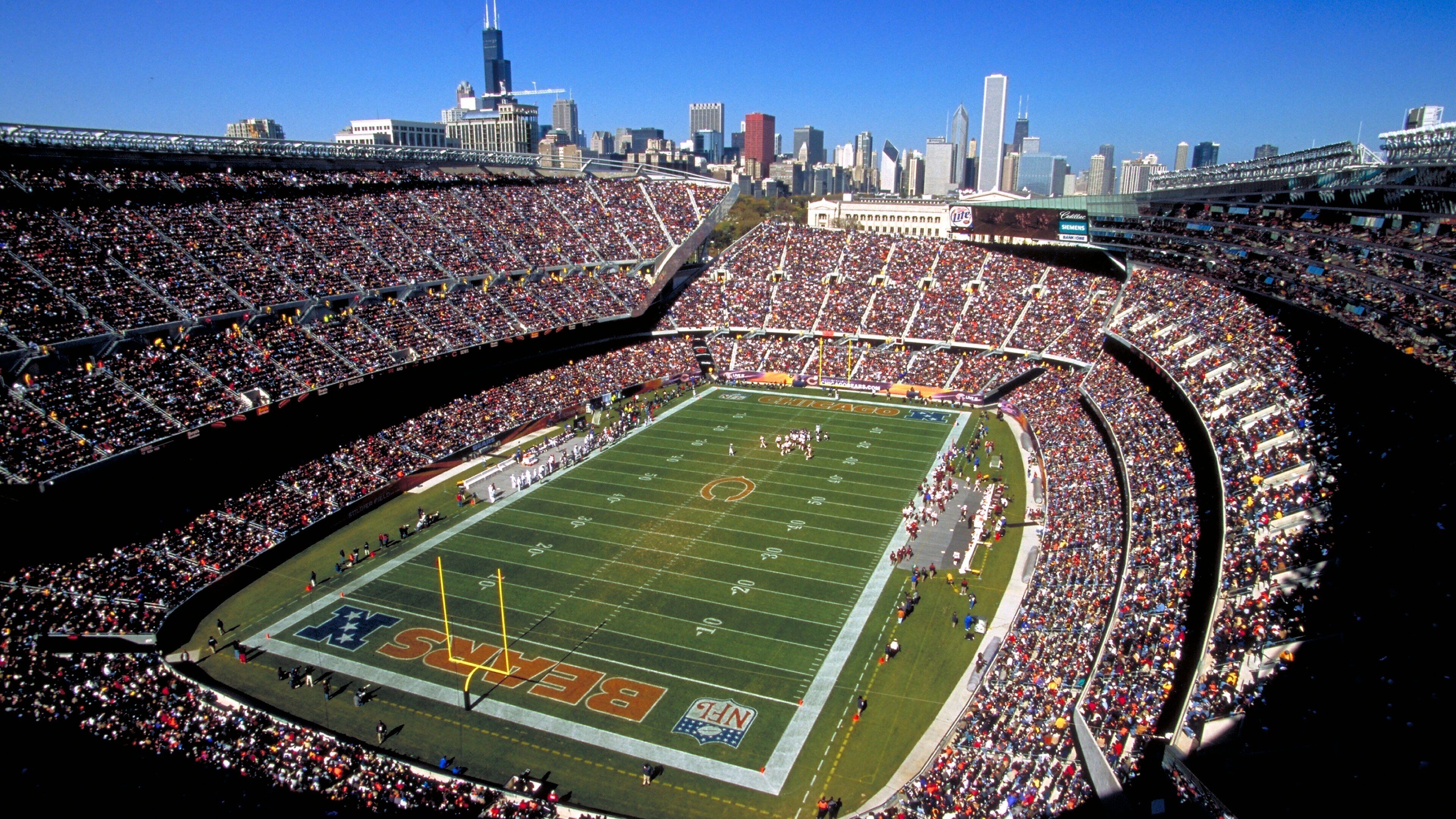 Soldier Field which includes a sporting event as well as a large group of people