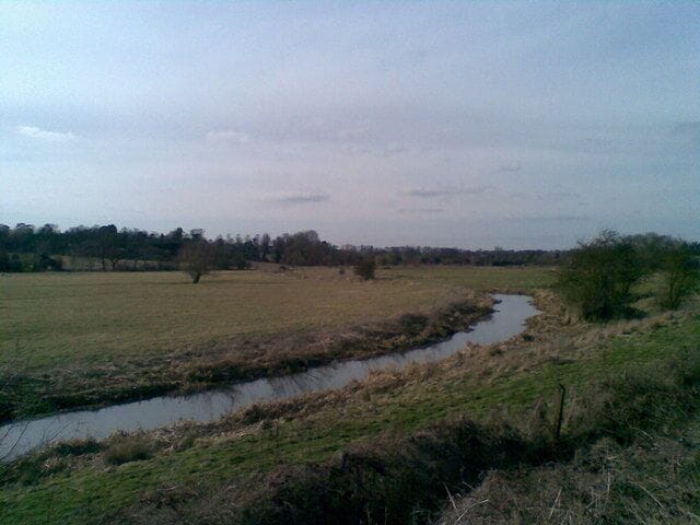 Brampton Valley Looking across the flood plain of a tributary of the River Nene towards Chapel Brampton.