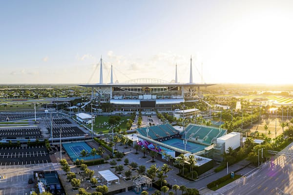 Miami Gardens, United States - 19 July 2025: Aerial view of the Hard Rock Stadium basks in the golden glow of the setting sun, a modern coliseum.