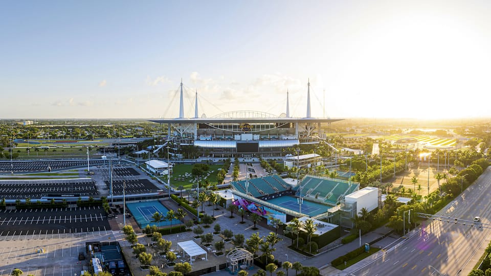 Miami Gardens, United States - 19 July 2025: Aerial view of the Hard Rock Stadium basks in the golden glow of the setting sun, a modern coliseum.