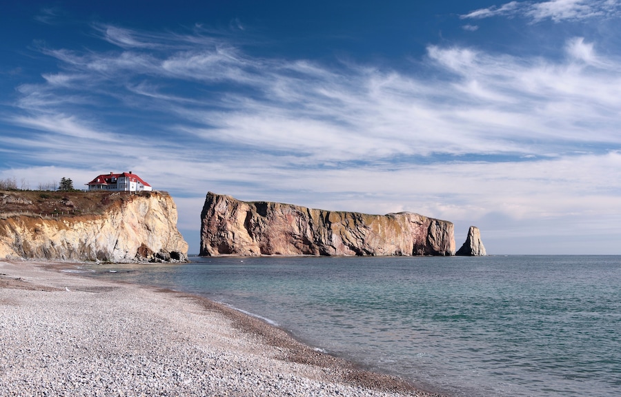 "House on a cliff besides Rocher Perce in Quebec, Canada"