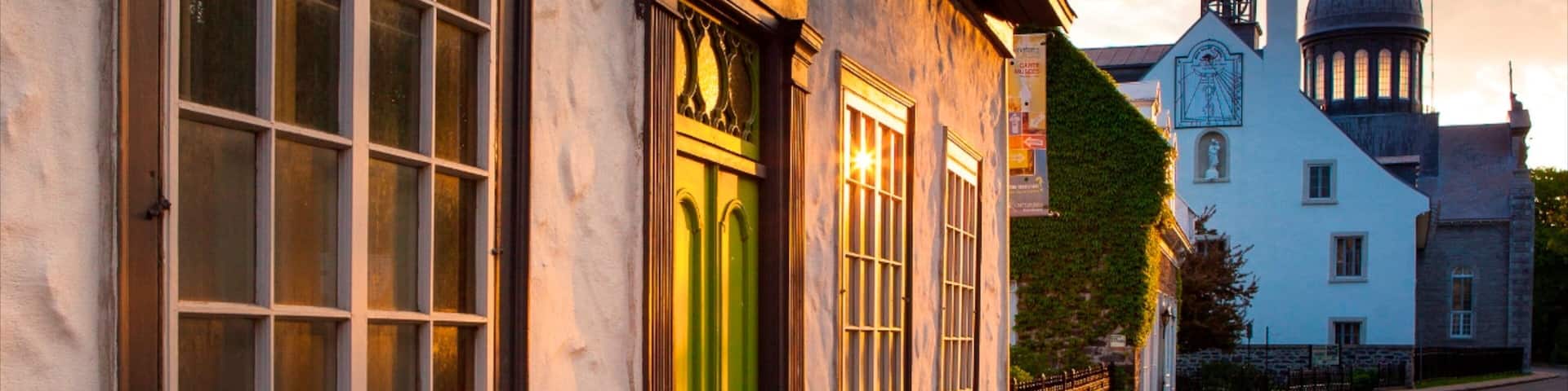 Trois-Rivieres featuring heritage architecture and a sunset