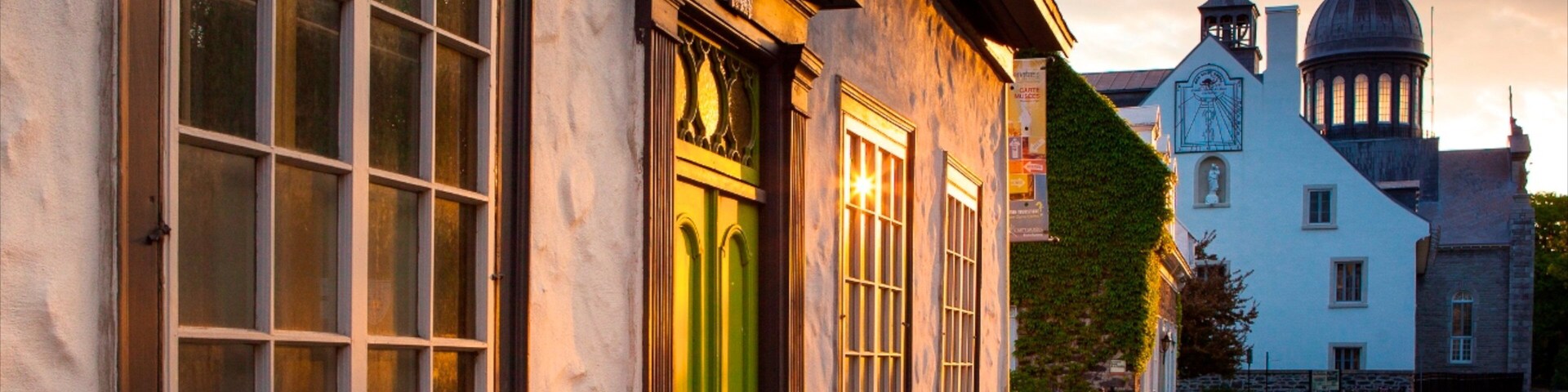 Trois-Rivieres featuring heritage architecture and a sunset