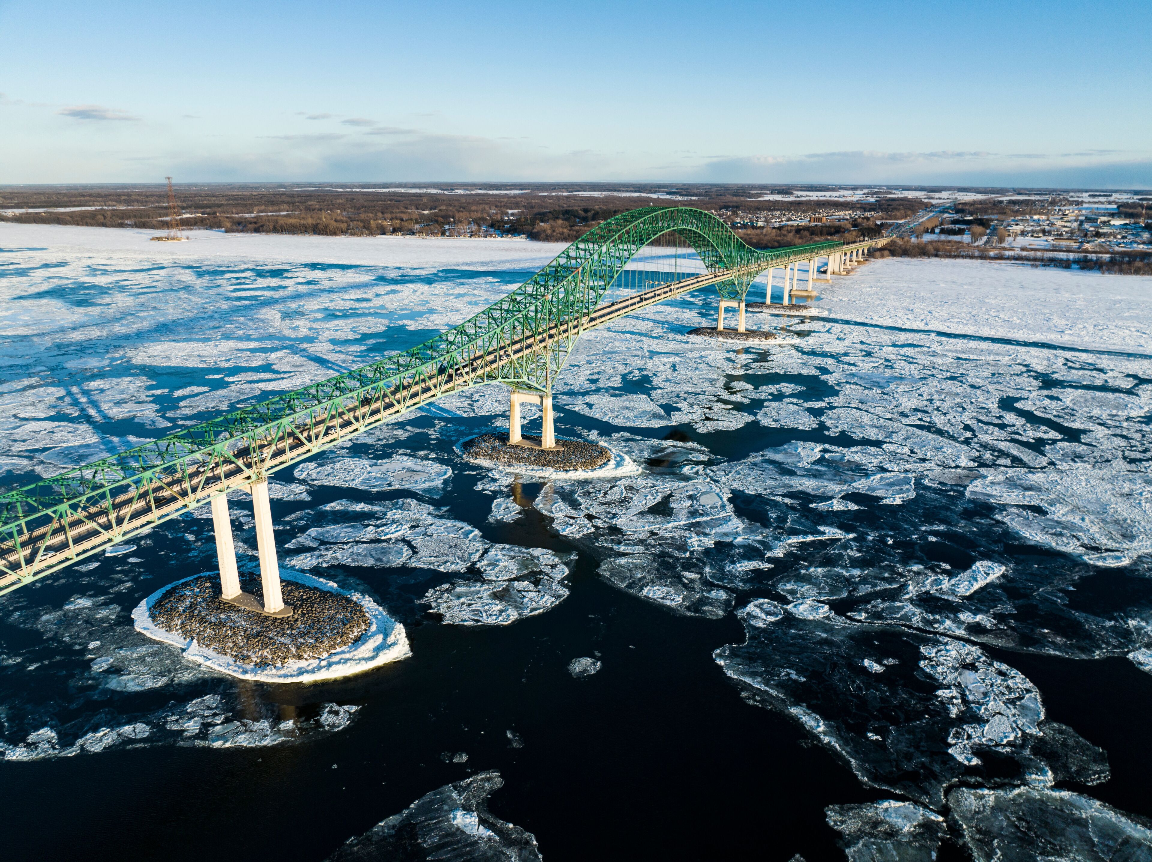 Laviolette Bridge, during winter, crossing the St. Lawrence River and ice floe in Trois-Rivieres, Quebec, Canada
