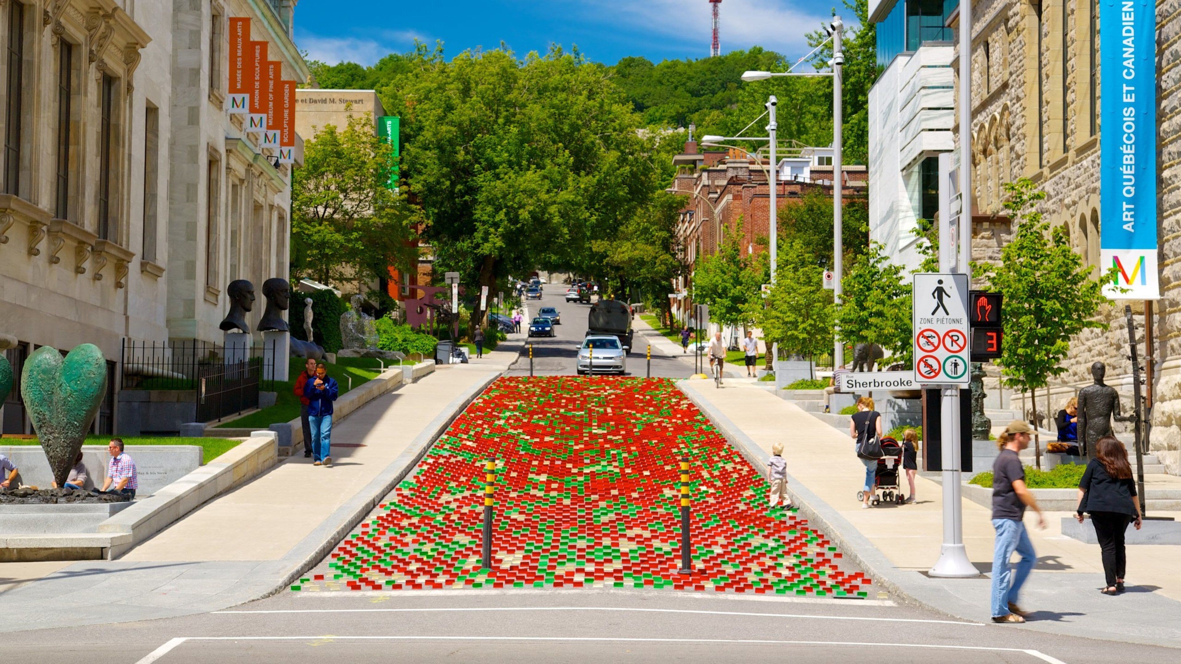 Downtown Montreal featuring outdoor art, a city and street scenes