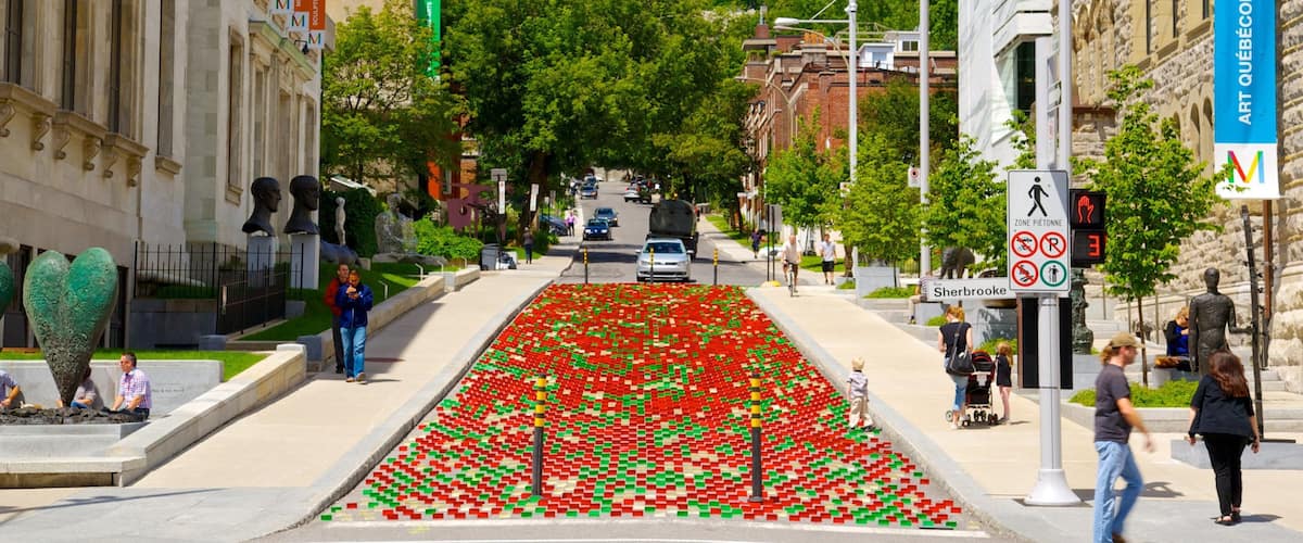 Downtown Montreal featuring outdoor art, a city and street scenes