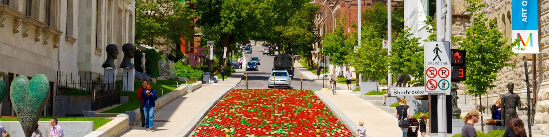Downtown Montreal featuring outdoor art, a city and street scenes
