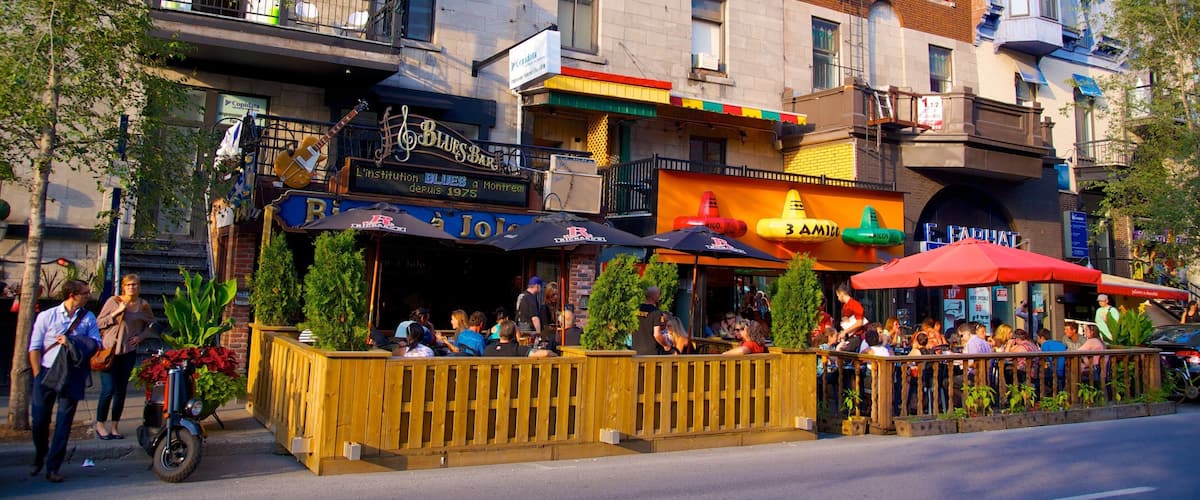 Latin Quarter which includes outdoor eating, cafe lifestyle and a city