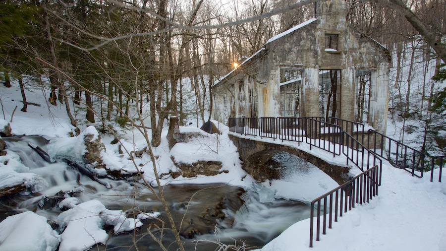 Outaouais featuring a bridge, a river or creek and snow