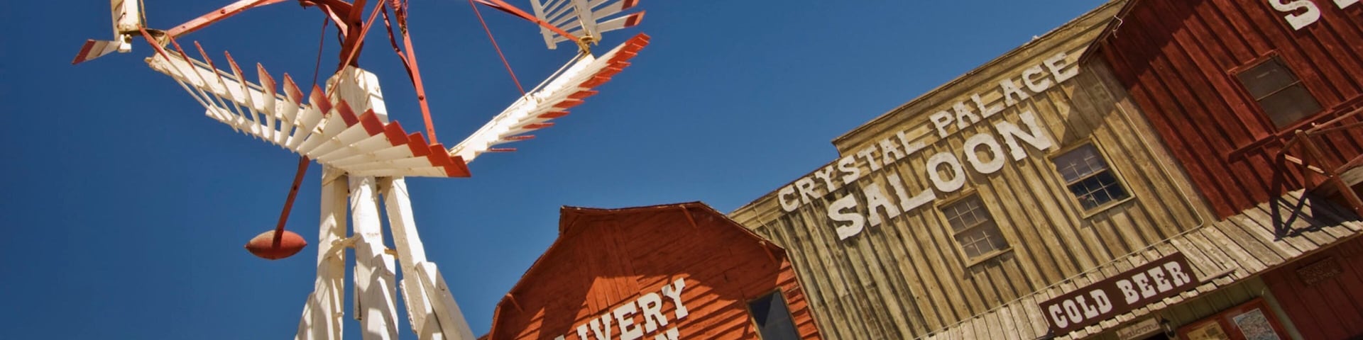 Ogallala showing a small town or village and signage as well as an individual femail