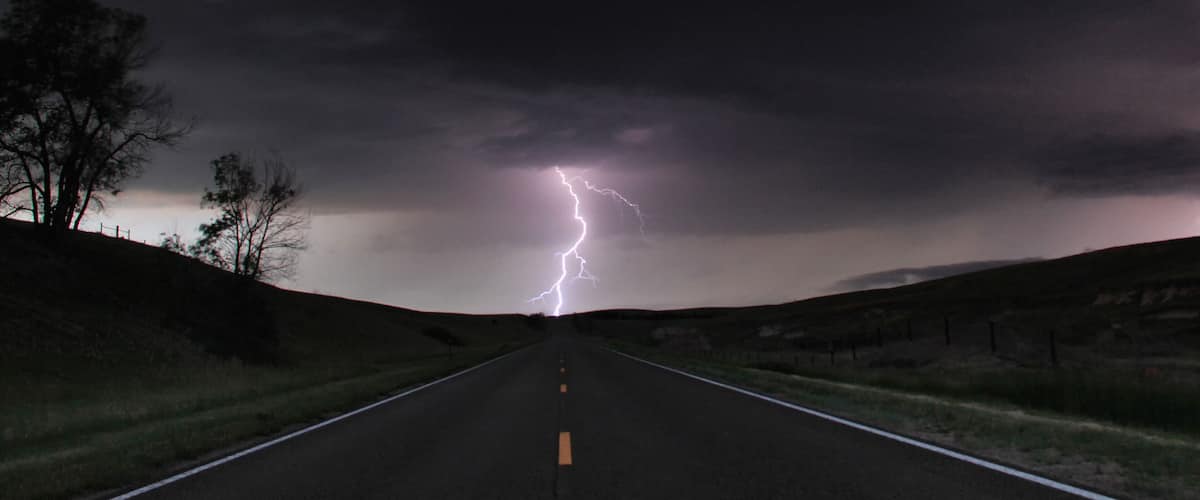 A road leading to a lightning strike in a rural area.