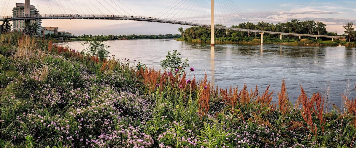 Bob Kerrey Pedestrian Bridge.
This stunning, 3,000-foot long walkway stretches across the Missouri River, giving pedestrians a spectacular view of Omaha’s skyline. On the Nebraska side, enjoy the 3-acre Omaha Plaza with an interactive water jet fountain, River Critters Environmental Play Area and access to the National Park Service Visitors Center. The bridge is connected to more than 150 miles of nature trails.
#Nebraska #travel #bridge