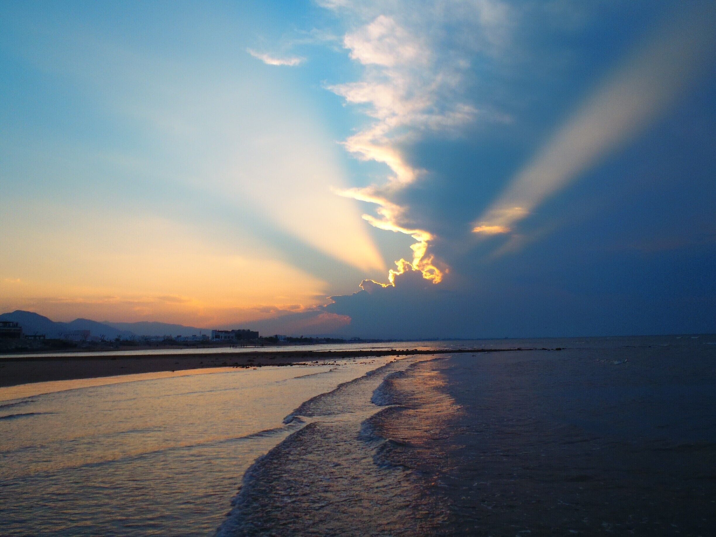 Low tide at sunset on Qurum Beach.  Low tide means football on the sand (high tide means no beach and water up to the wall...)
#blue