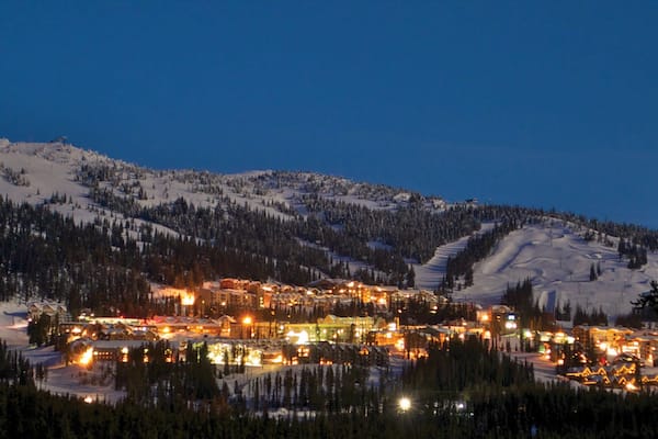 Big White Ski Resort showing night scenes, a small town or village and snow