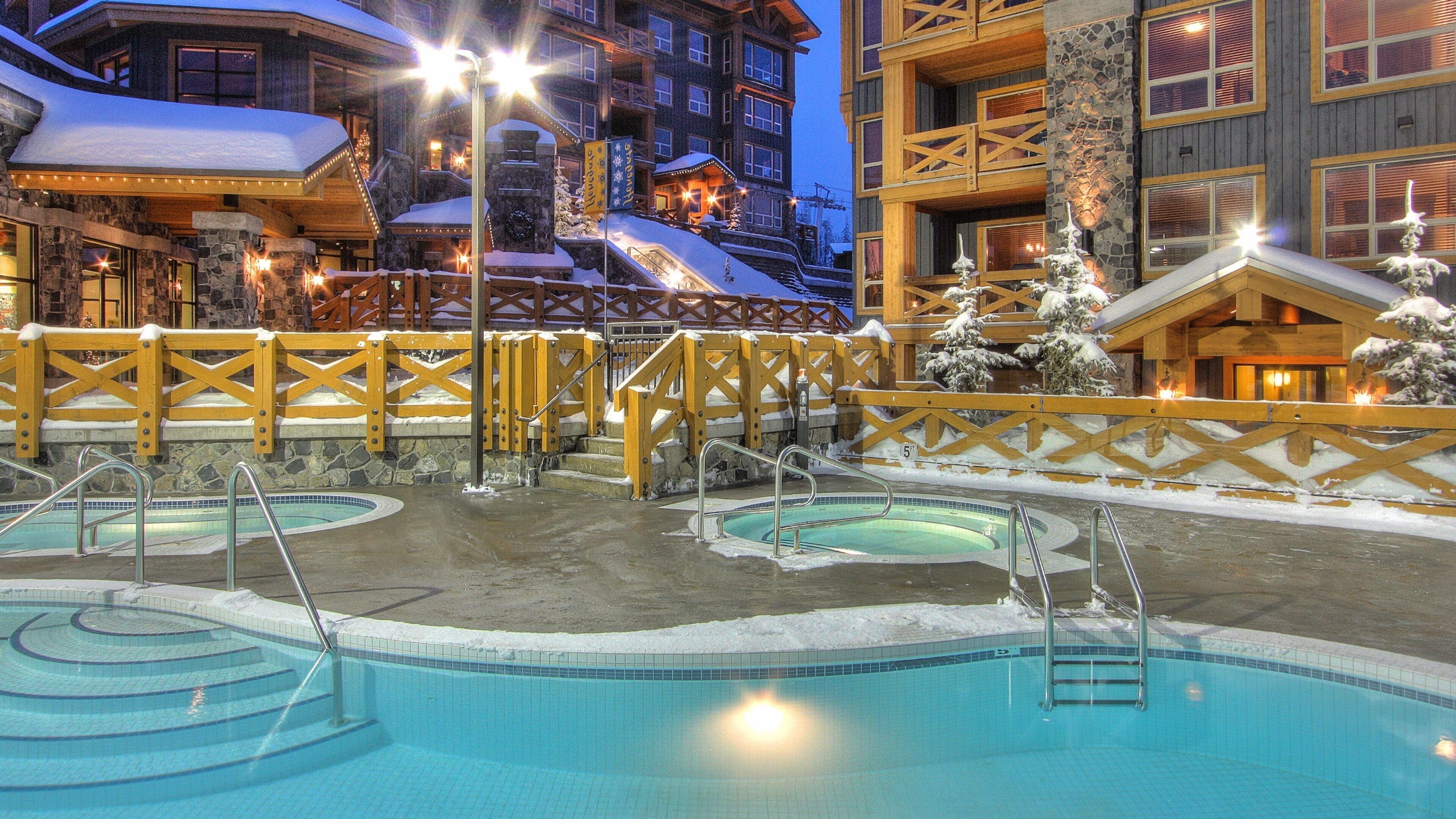 Big White Ski Resort which includes a luxury hotel or resort and night scenes