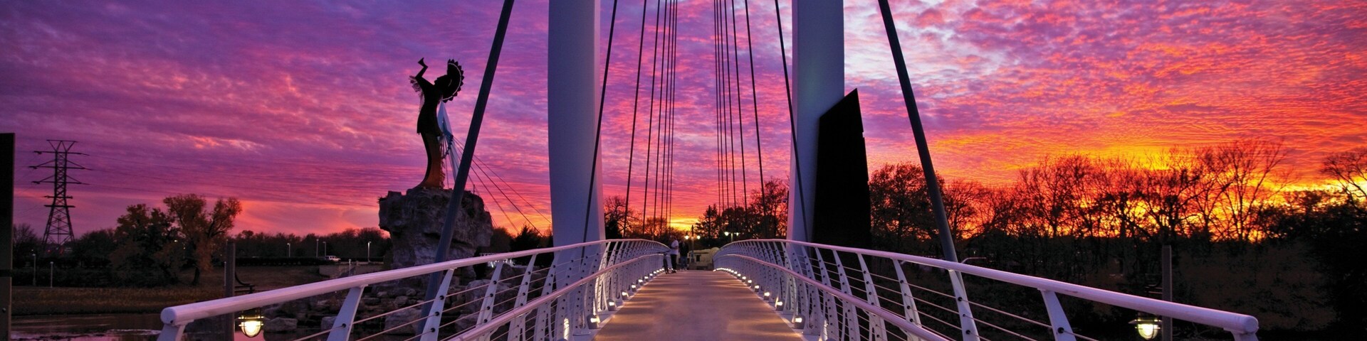 Wichita featuring a sunset and a bridge