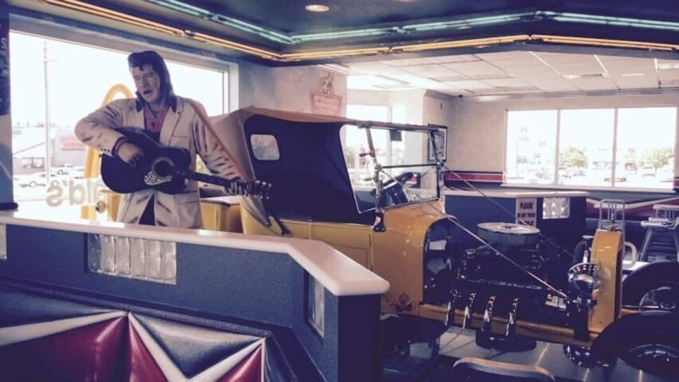 Who knew Topeka rated such a fancy theme McDonald's? If life throws you a situation where you have to eat McD's at least you can do it in style with Elvis and a sweet hot rod! Also many other vintage items, neon, and murals of muscle cars at the drive in on every wall.