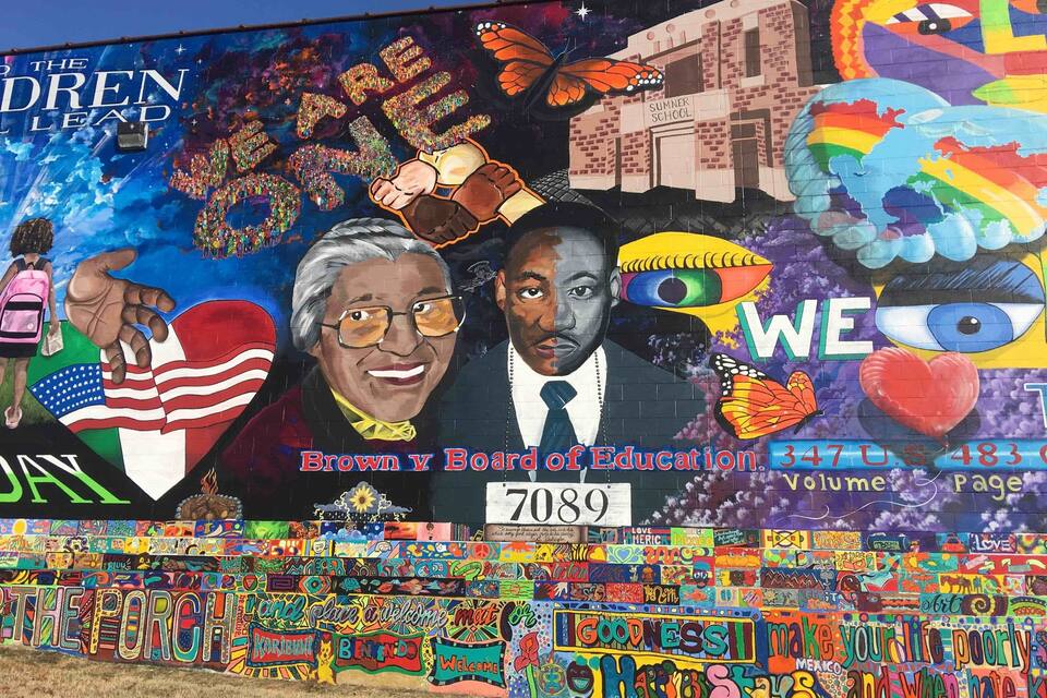 A mural with educational and motivational themes, including references to Brown v. Board of Education and a school named Summer School.