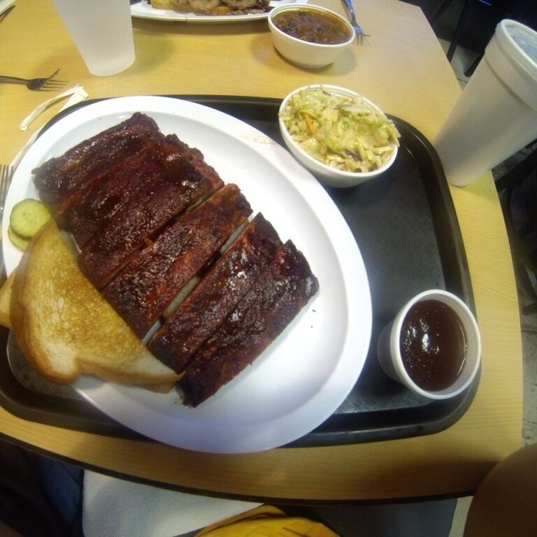 Oklahoma Joe's BBQ! This place is a legend. Started in a gas station...and still in a gas station. Although they have new locations, this is the original. The line was about 75-100 people long, if that tells you anything. And the entire place was packed. I tried the ribs and a bite of the pork sandwich, both were amazing. Extremely well smoked. The fries have some seasoning that  pretty sure is made of drugs. If you want KC BBQ, go here! 