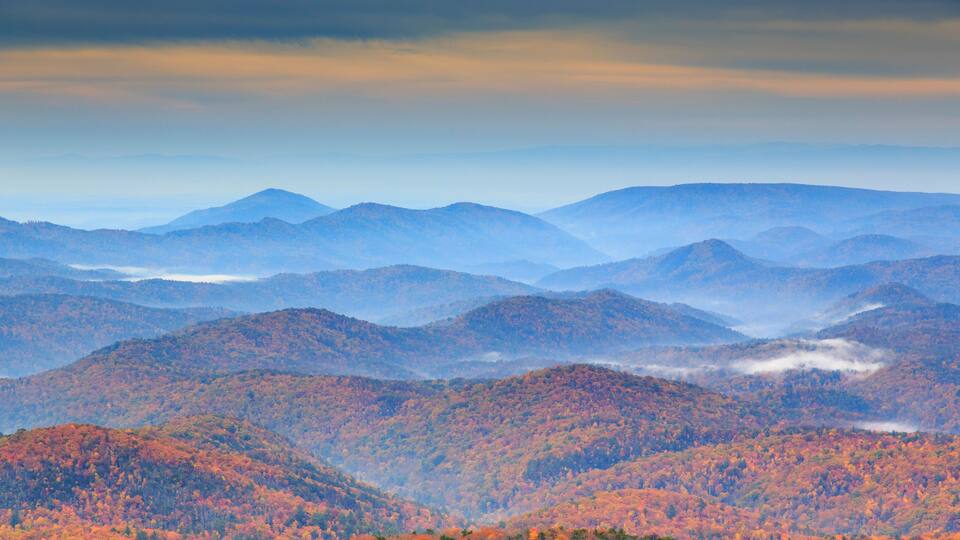 A mountainous landscape with autumn foliage.