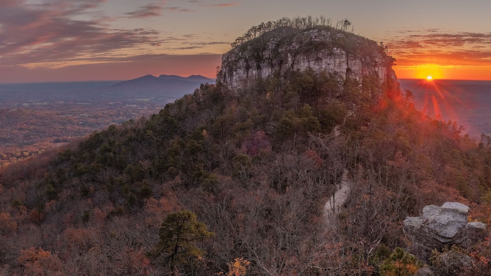 Autumn panorama sunrise view of the knob from Little Pinnacle at Pilot Mountain State Park in Pinnacle, NC.