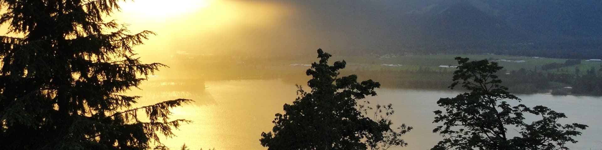 Sunset on Fraser Valley as a storm creeps up the valley