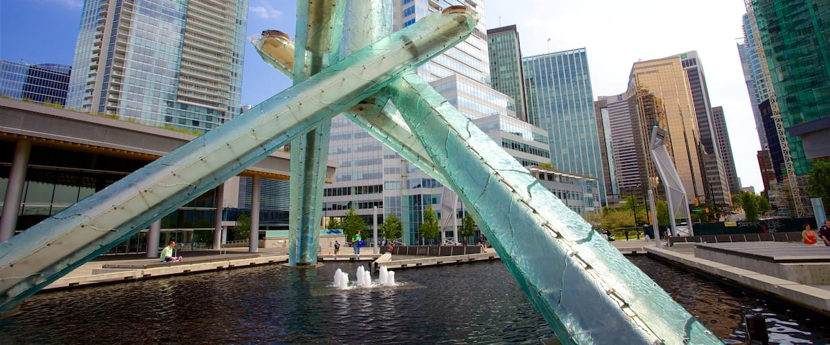 Downtown Vancouver showing a city, a fountain and outdoor art