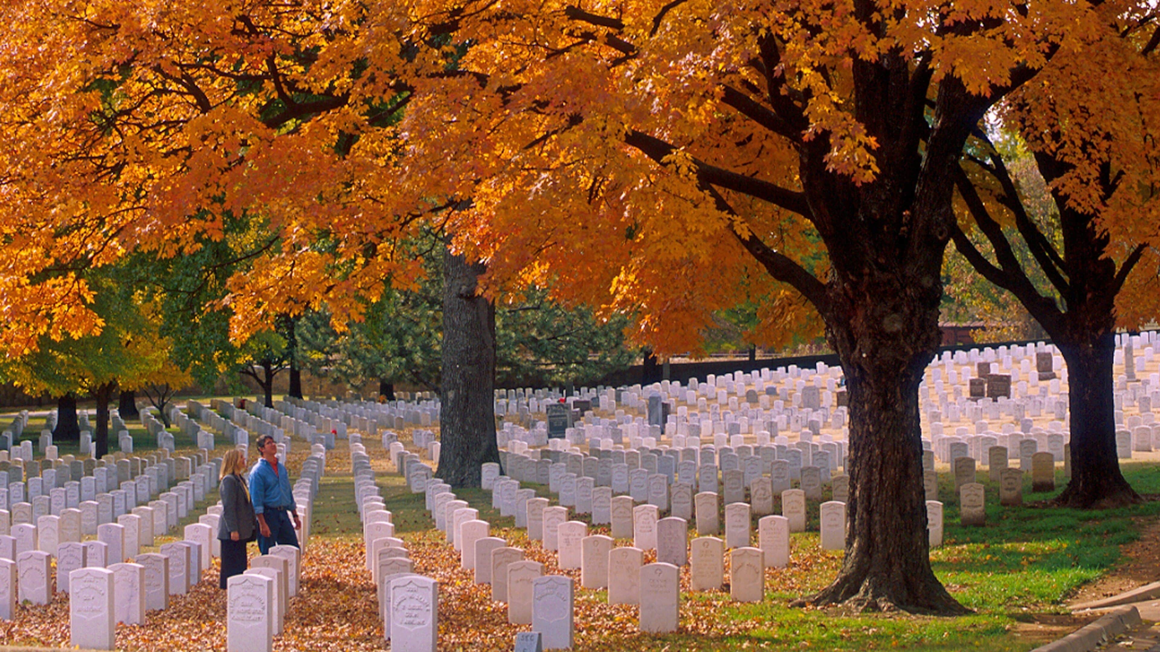 Fort Smith which includes autumn leaves and a cemetery as well as a couple