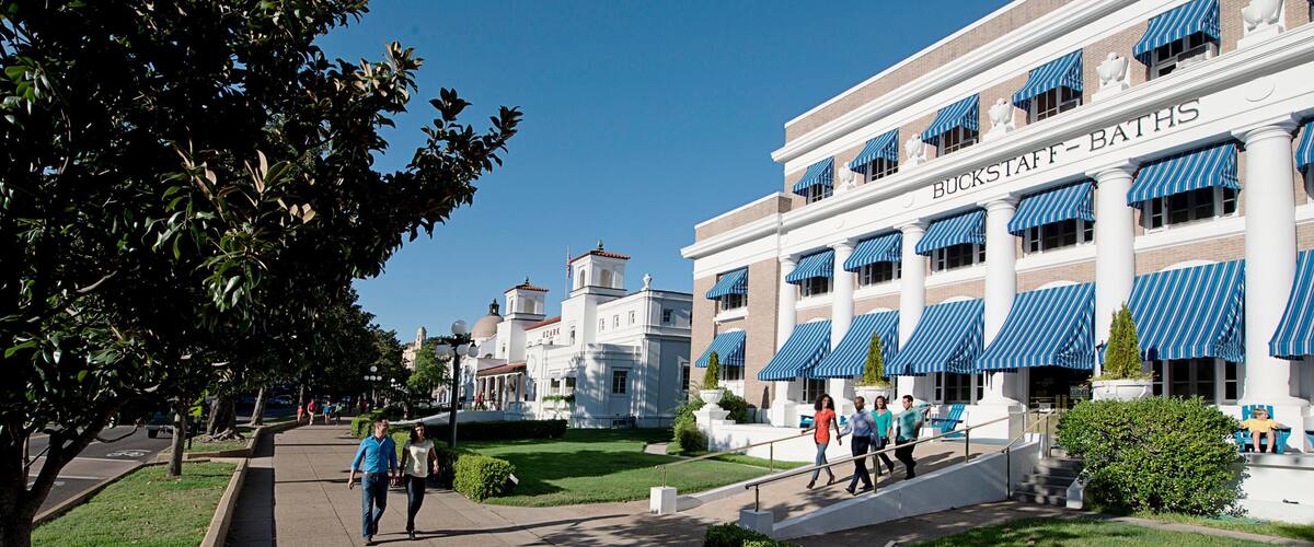 A building with blue awnings and the name "BUCKSSTAFF BATHS" on the facade.