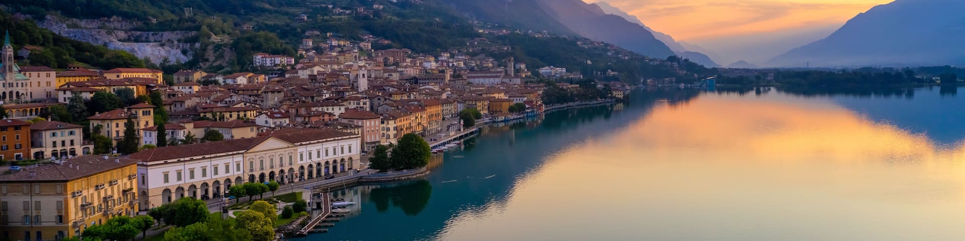 Aerial view of Lake Iseo at sunrise, on the left the city of lovere which runs along the lake,Bergamo Italy.