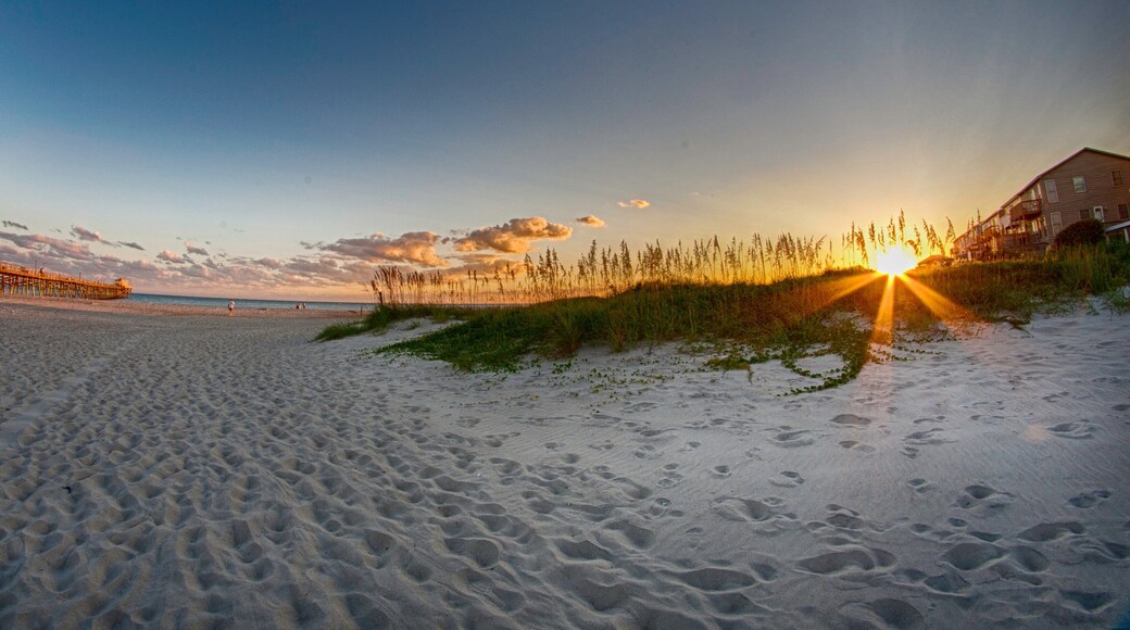 Morehead City which includes a sandy beach and a sunset