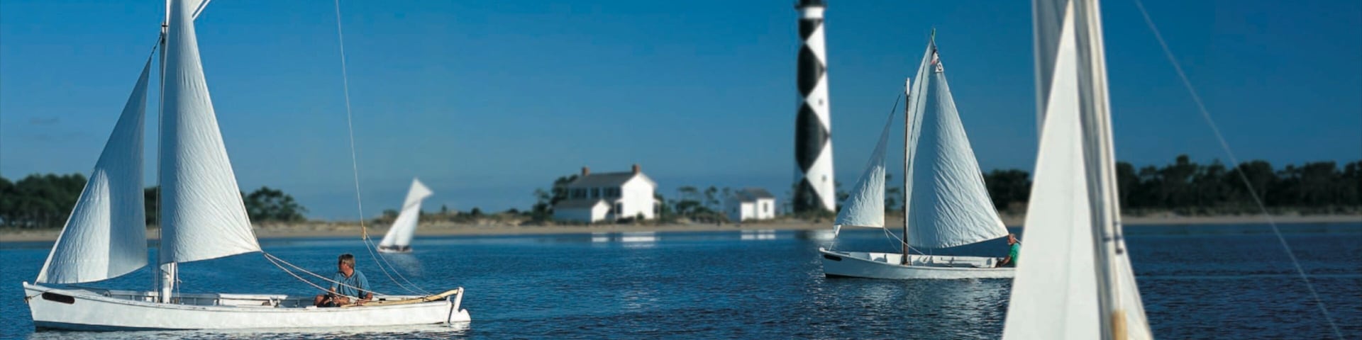 Morehead City which includes a lighthouse and sailing