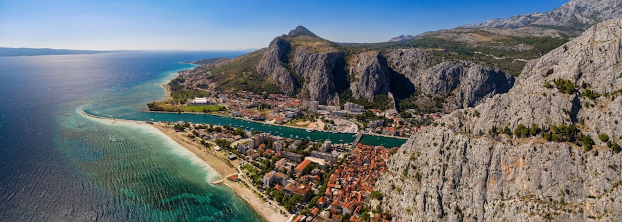Panorama of town Omis in Croatia - travel background. Aerial drone picture in august 2020
