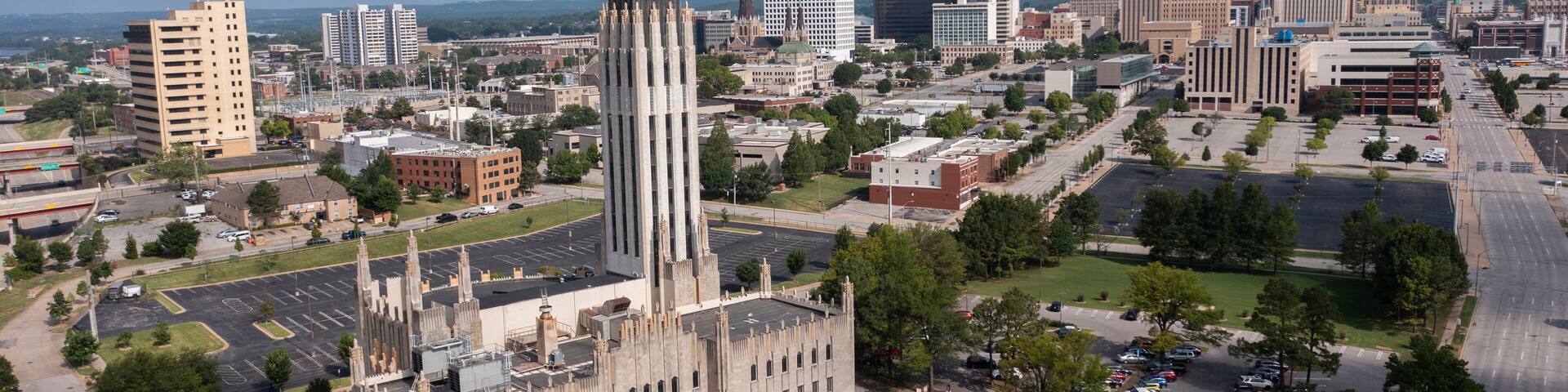 Tulsa, Oklahoma, USA - June 25, 2023: Afternoon sun shines on historic buildings of downtown Tulsa.