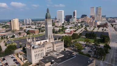 Tulsa, Oklahoma, USA - June 25, 2023: Afternoon sun shines on historic buildings of downtown Tulsa.
