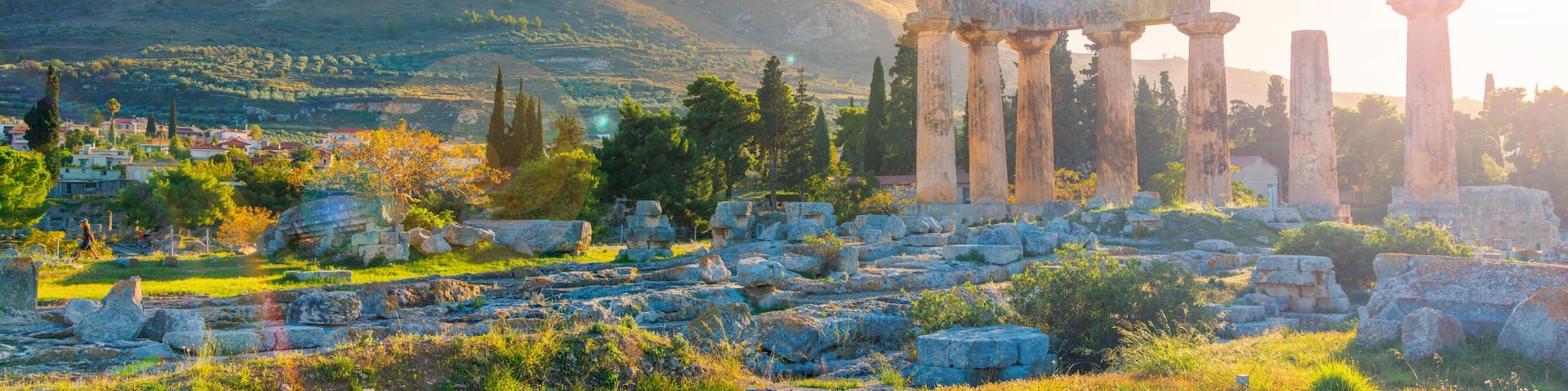 Ruins of temple of Apollo at sunset, Ancient Corinth in Greece