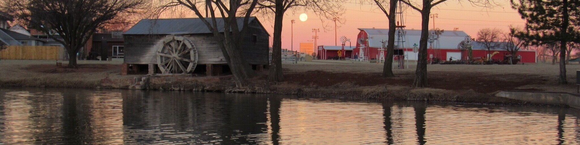 This is the pond at Ackley Park in Elk City. The moon is the Full Snow Moon reflecting in the pond. Ackley Park has a carousel and miniature golf, and fishing is allowed in the pond for youngsters.