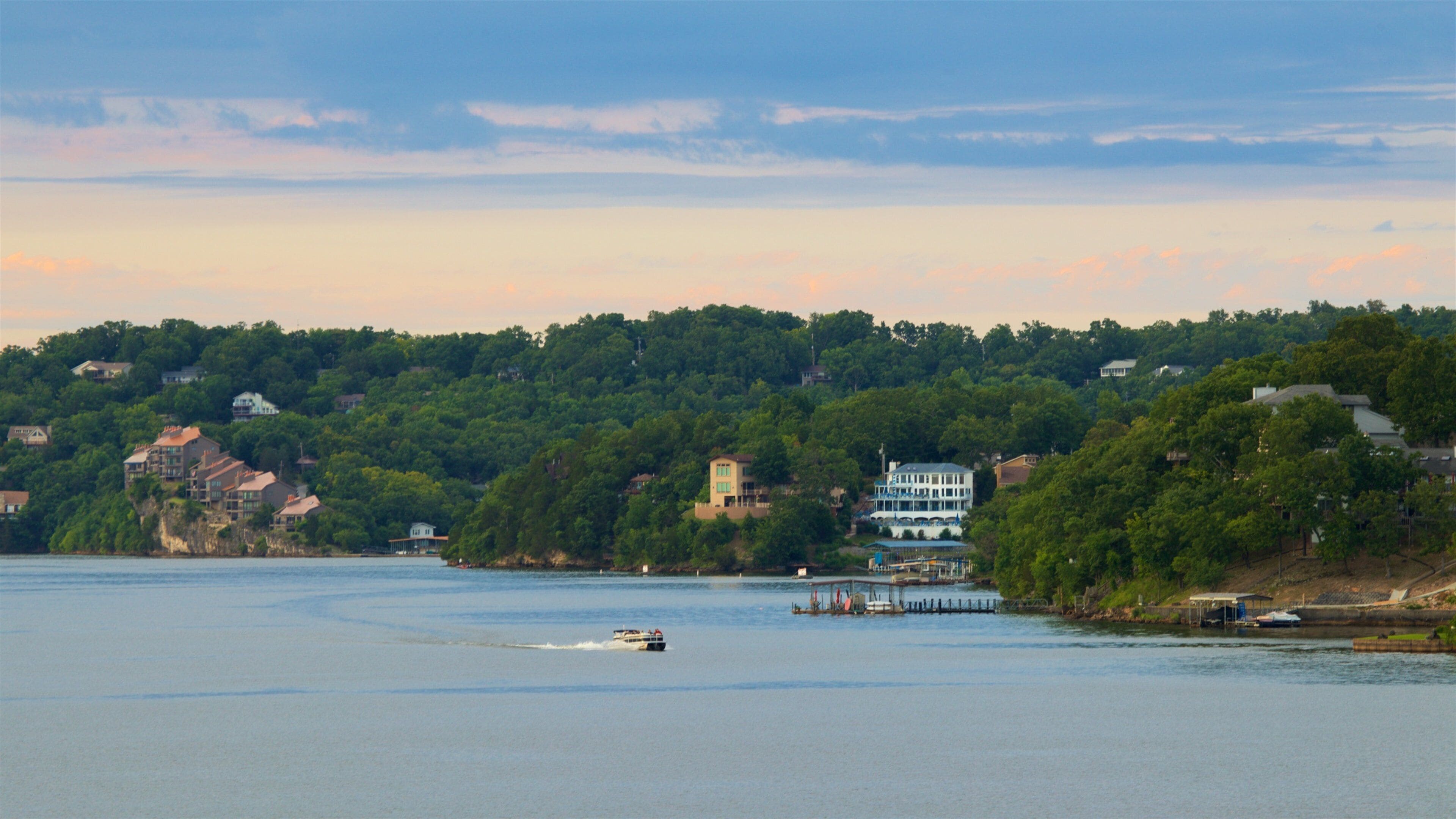Osage Beach which includes boating, a lake or waterhole and a sunset