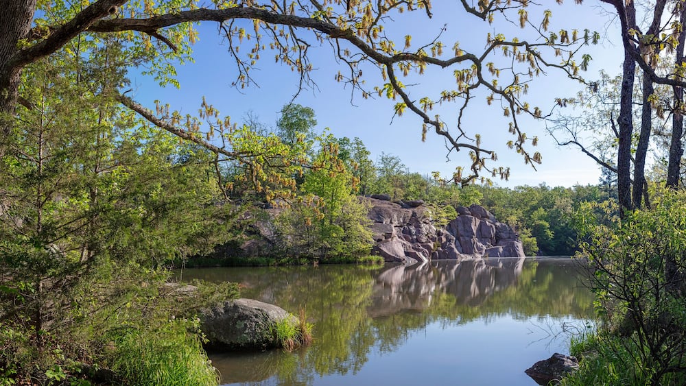 Scenic landscape of a flooded old quarry site at Elephant Rocks State Park in Belleview, MO