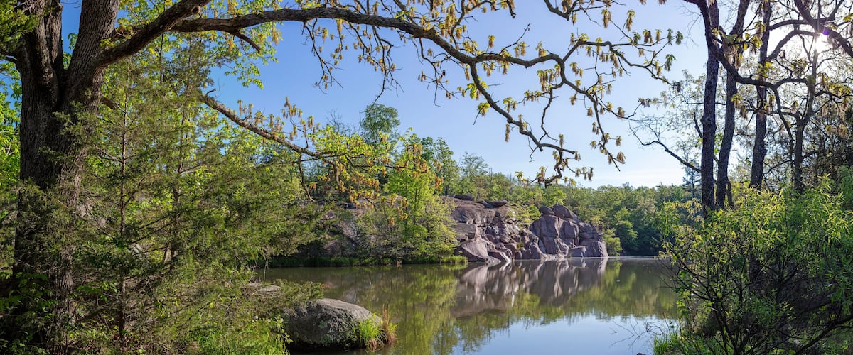 Scenic landscape of a flooded old quarry site at Elephant Rocks State Park in Belleview, MO