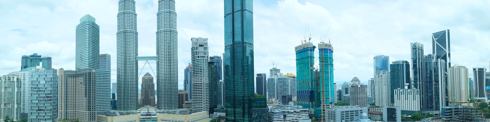 City skyline view of Kuala lumpur with iconic Twin towers and commercial buildings, Malaysia